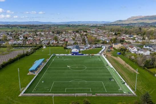 The new pitch nearing completion, with markings laid and grass green